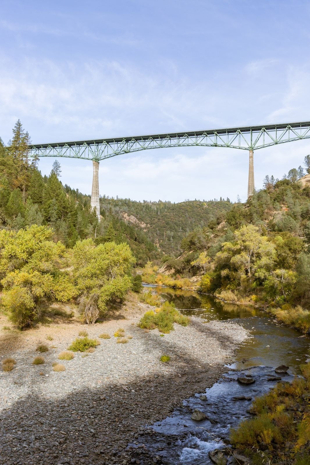 Bridge over a trail and river in California's Gold Country