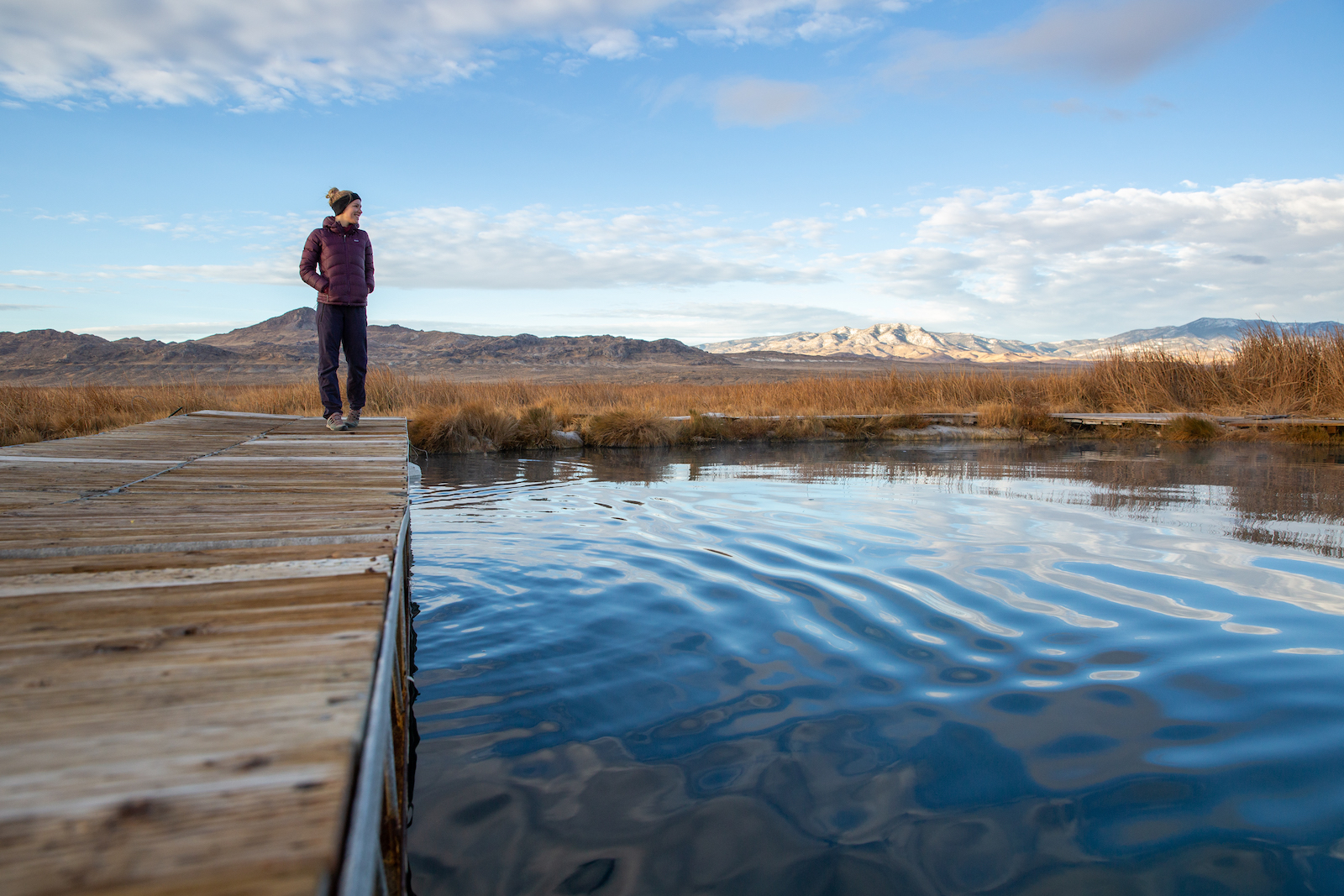 Woman at edge of Blue Lake in Cowboy Country, Nevada