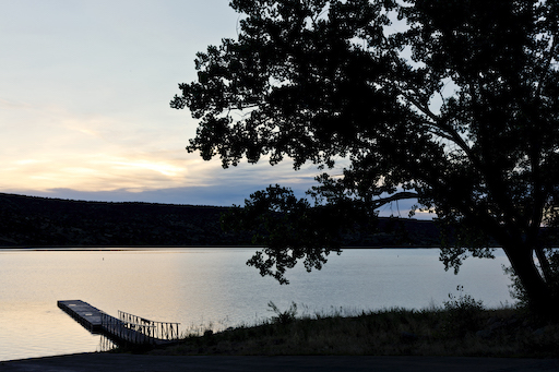Sunset with tree and pier at Lyman Lake State Park in Arizona