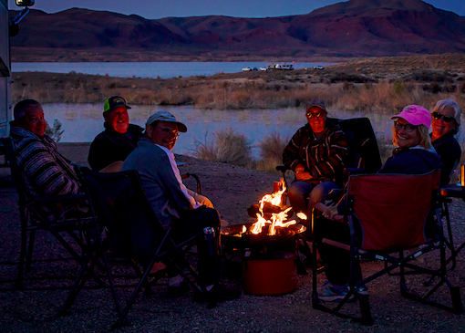 Campers around campfire at Alamo Lake State Park