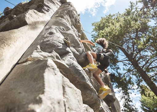 Child on the climbing wall at Jackson Hole Mountain Resort