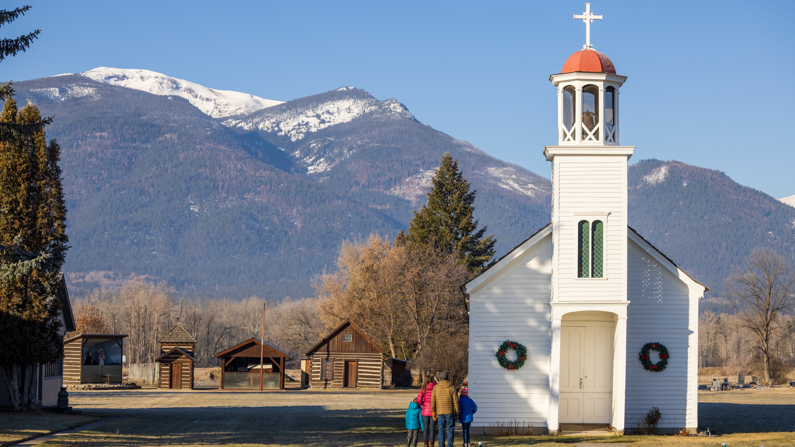 Family looking at St. Mary's Mission in Stevensville, Montana