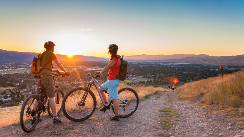 People biking at sunset in Missoula, Montana