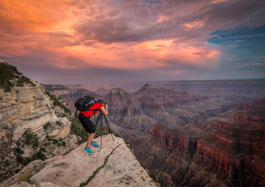 This is my friend Sarah AlSayegh photographing a great sunset on the North Rim of the Grand Canyon. There's a funny story I have to share on this one. When we first arrived at this spot, there was a girl sitting off to the side jabbering away on her cell phone. I was surprised she even got cell phone reception there. We walked out to the point and started setting up. Then inexplicably, the girl came and sat down right in front of our tripods, still jabbering away on her phone. We thought that was odd and had to adjust our compositions to keep her out of it. When she was done talking, she turned to us and said what we had done was the rudest thing she'd ever seen. She said her sister was a professional photographer (I don't know why that had anything to do with the conversation). And then she hoped that we wouldn't get a single good photograph on our entire trip. Sarah was great, and just responded with a happy 