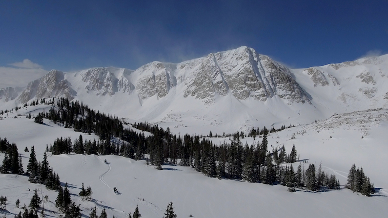 Snowy Range - Snowmobiling Drone with Medicine Bow Peak behind
