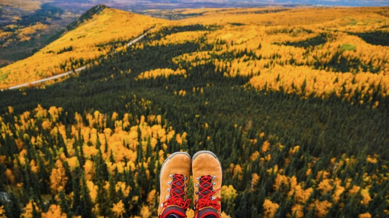 Hiking boots in front of an overlook in Alaska
