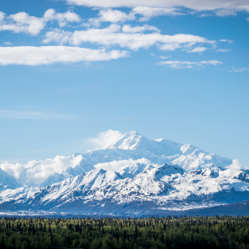 A wellness retreat can include visits to spiritually sacred sites, like Mt. Denali in Alaska